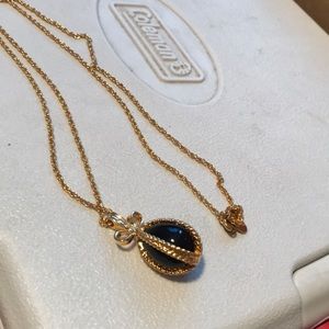 Gold necklace with black end